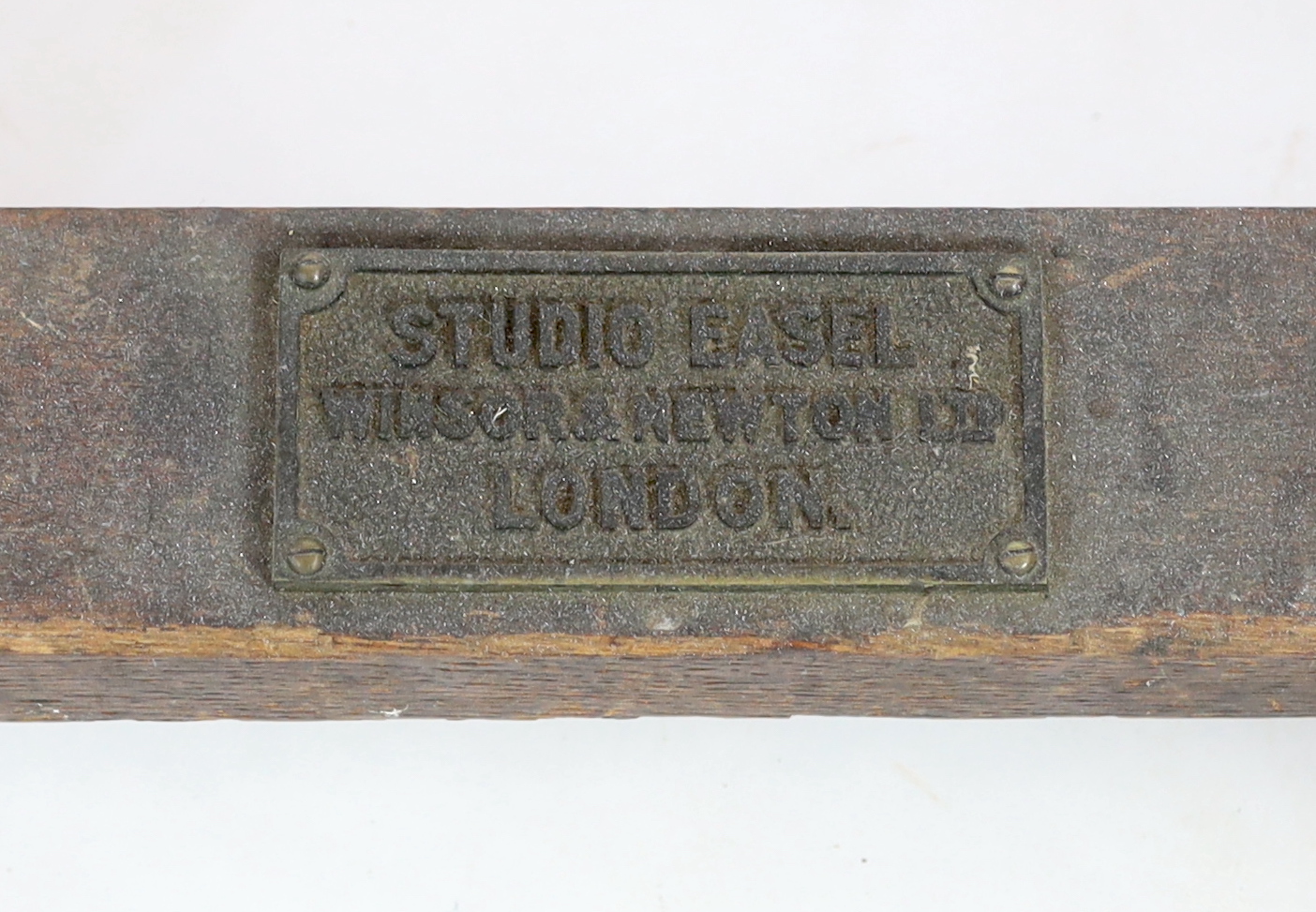 A Winsor & Newton oak studio easel, with cast brass plaque ‘Studio Easel, Winsor & Newton, Ltd, London’, 62cm wide, 64cm deep, 183cm high